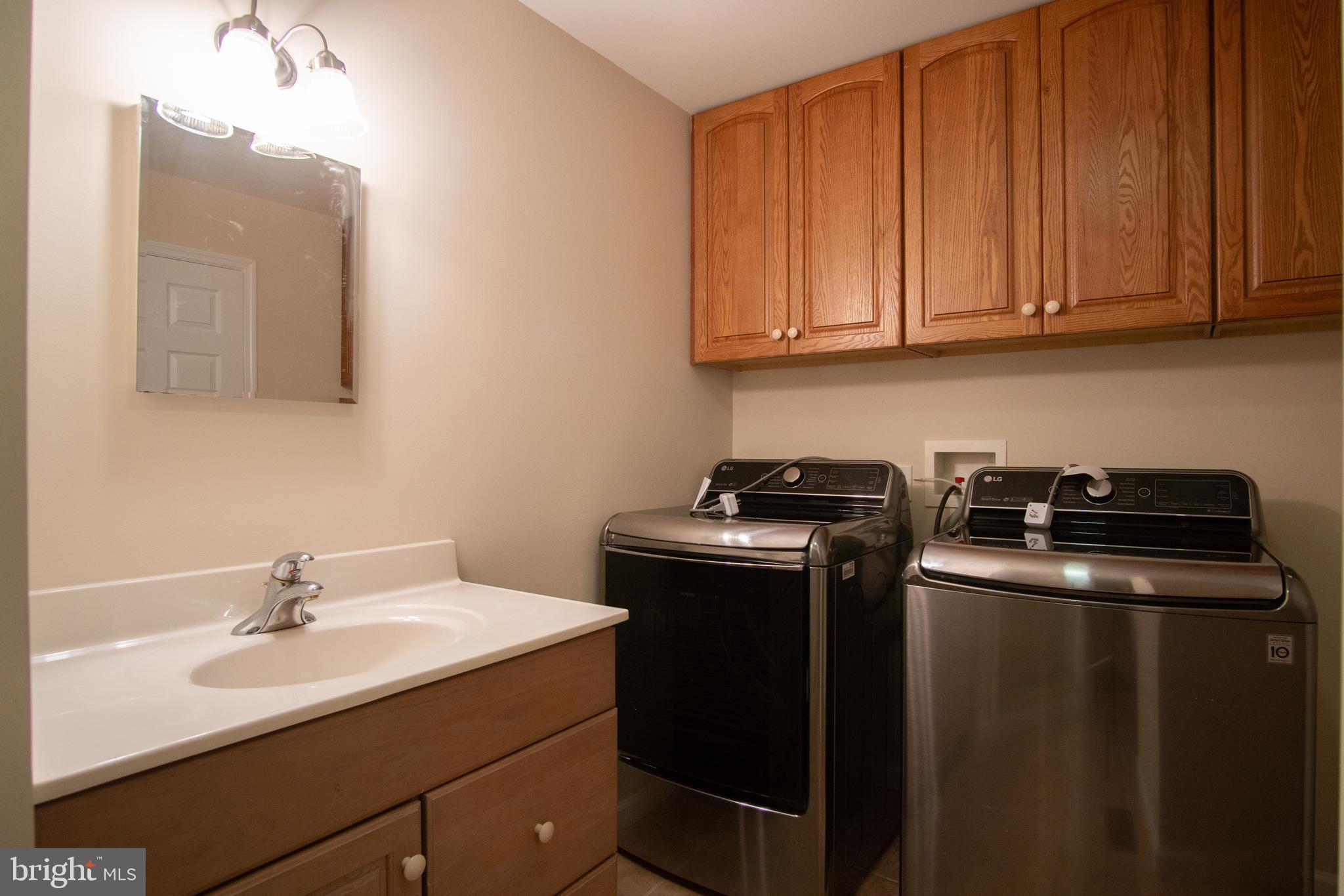 49701 Airedele Road Ridge, MD 20680 - Photo 22 of 53 Newer washer and dryer off the kitchen