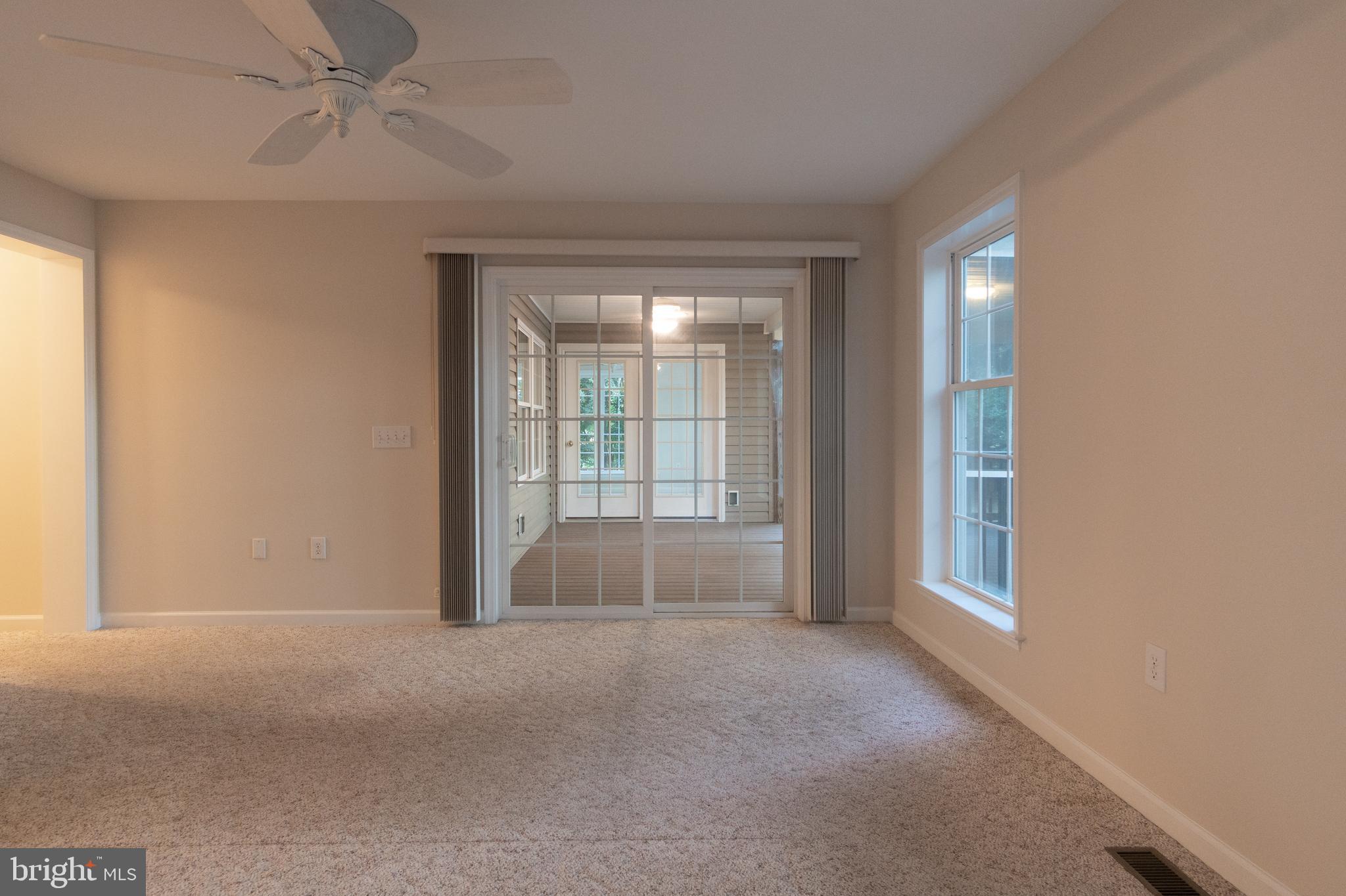 49701 Airedele Road Ridge, MD 20680 - Photo 23 of 53 Master bedroom w'doors leading to screened porch