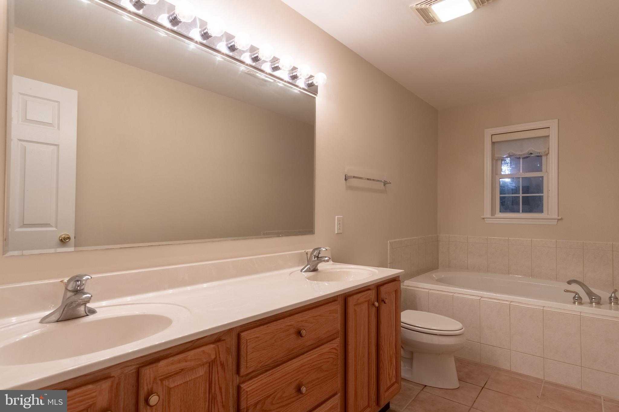 49701 Airedele Road Ridge, MD 20680 - Photo 26 of 53 Hallway bathroom with soaking tub