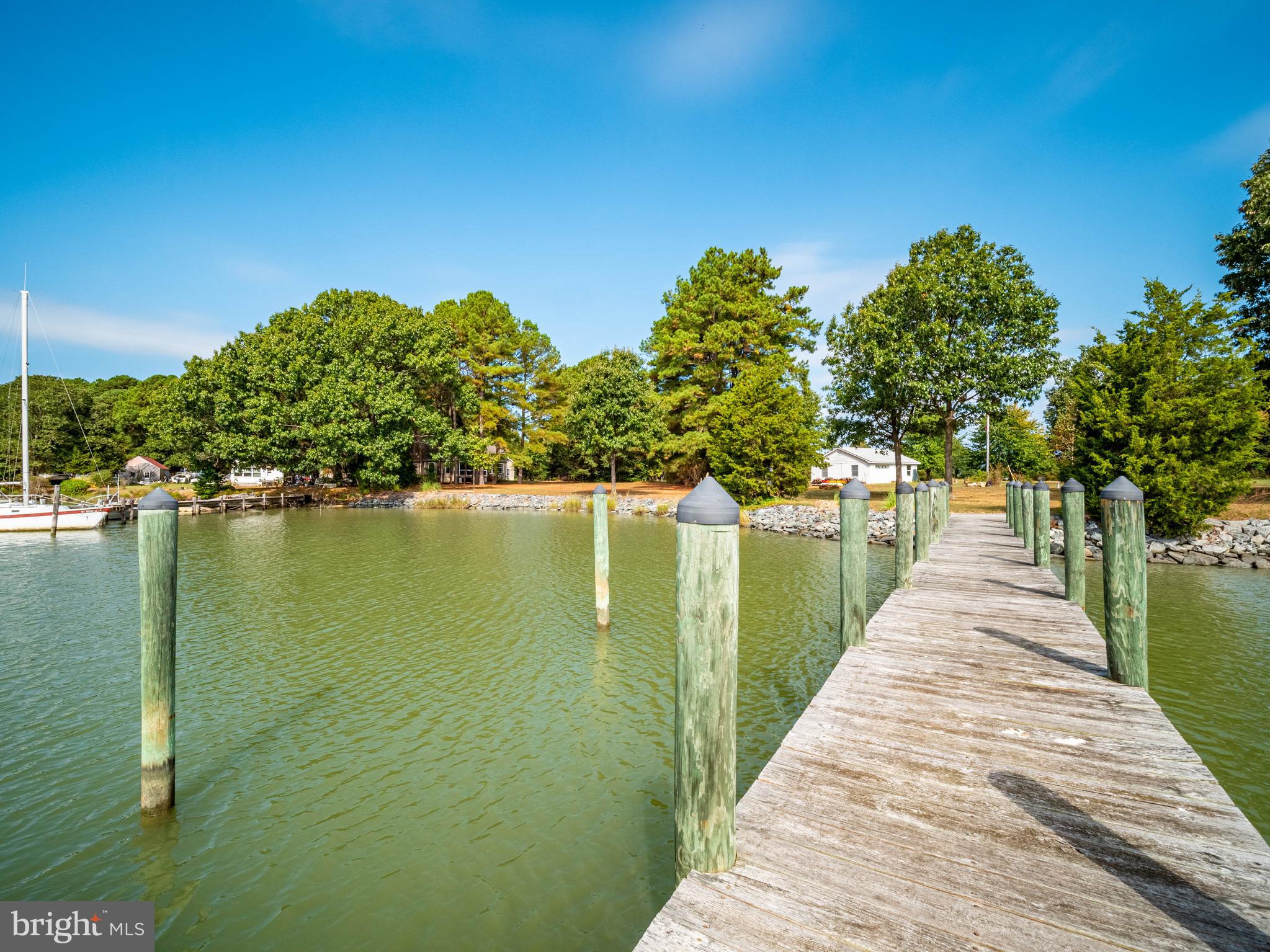 49701 Airedele Road Ridge, MD 20680 - Photo 33 of 53 The house in to the left of the pier
