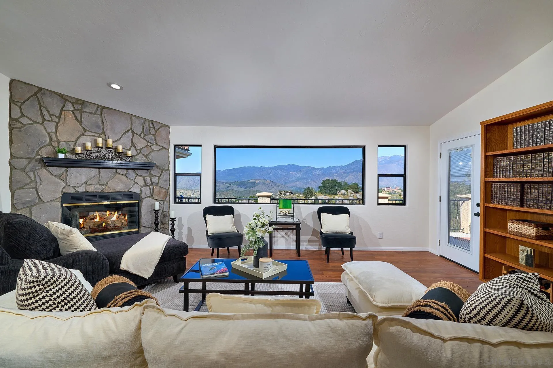 13588 McNally Road Valley Center, CA 92082 - Photo 6 of 43 a living room with furniture and a fireplace
