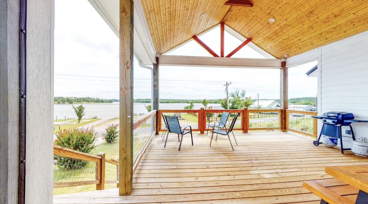 850 Triple Creek Loop Livingston, TX 77351 - Photo 1 of 18 a view of a balcony with wooden floor and outdoor space