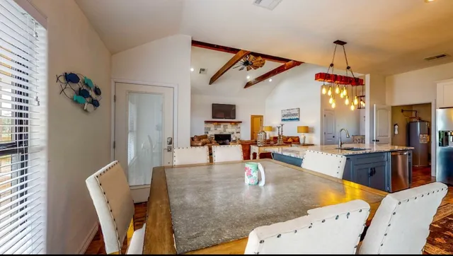 a view of a living room and dining room