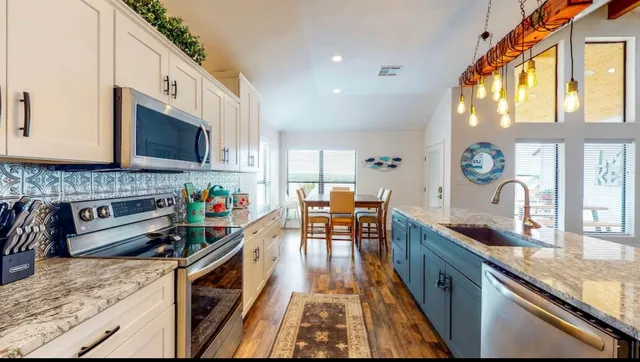 a kitchen with granite countertop lots of counter top space