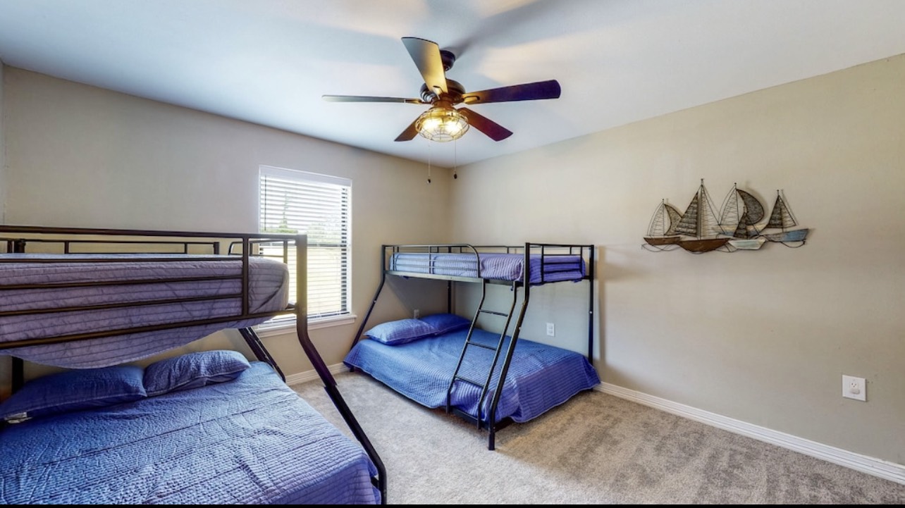 850 Triple Creek Loop Livingston, TX 77351 - Photo 10 of 18 a bedroom with furniture and a ceiling fan