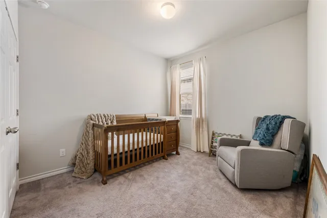 a bathroom with a toilet a sink and a mirror