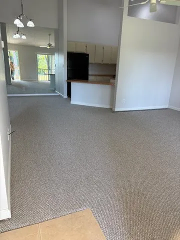 a view of a living room with furniture and a flat screen tv