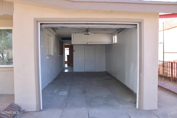 a view of a hallway to rooms