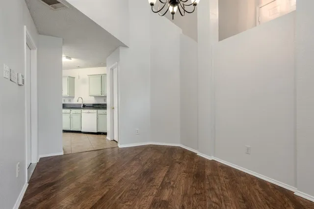 a view of a kitchen with a sink and cabinets