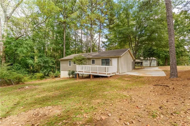 a house with trees in the background