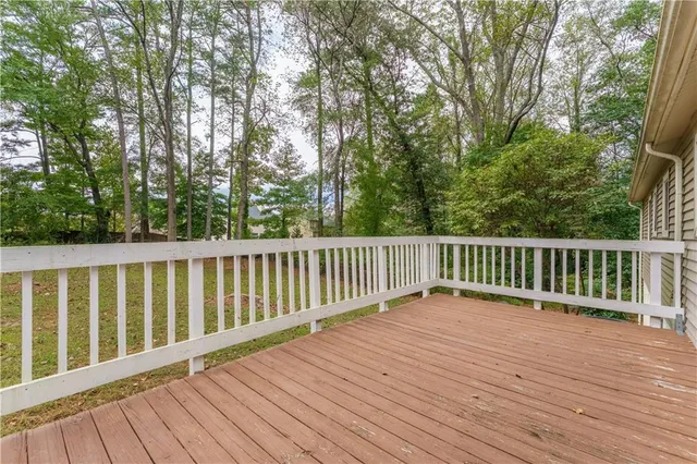 a view of wooden deck and a yard