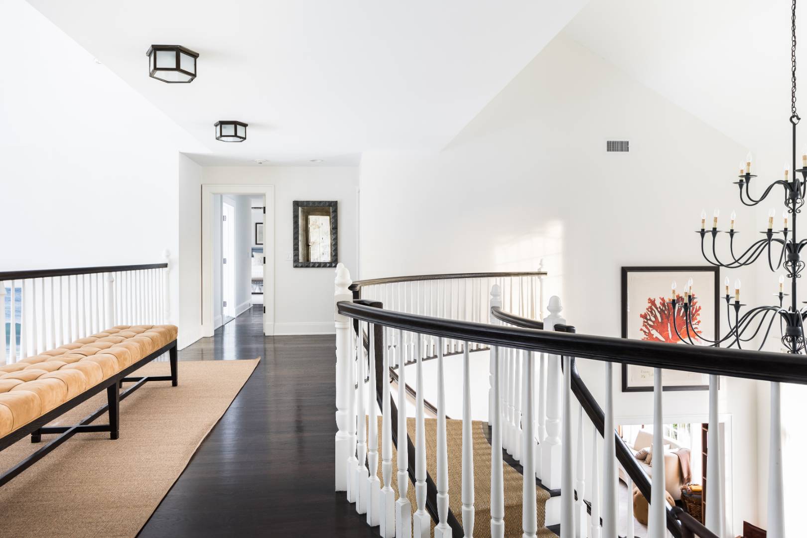 495 Ox Pasture Road Southampton, NY 11968 - Photo 11 of 28 a view of staircase with lots of frames on wall and a window