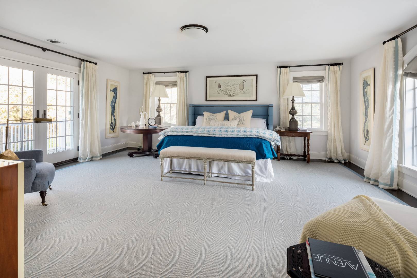 495 Ox Pasture Road Southampton, NY 11968 - Photo 12 of 28 a spacious bedroom with a bed couch and a window