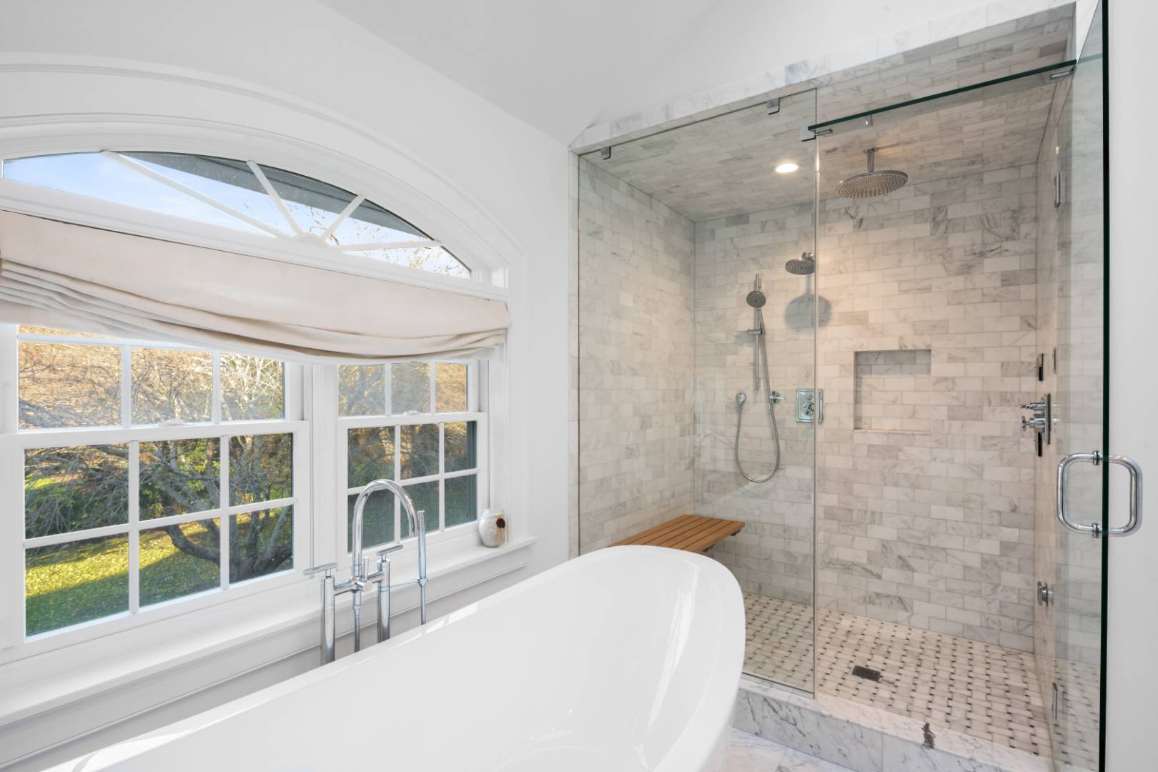 495 Ox Pasture Road Southampton, NY 11968 - Photo 15 of 28 a bathroom with a granite countertop bathtub next to a window