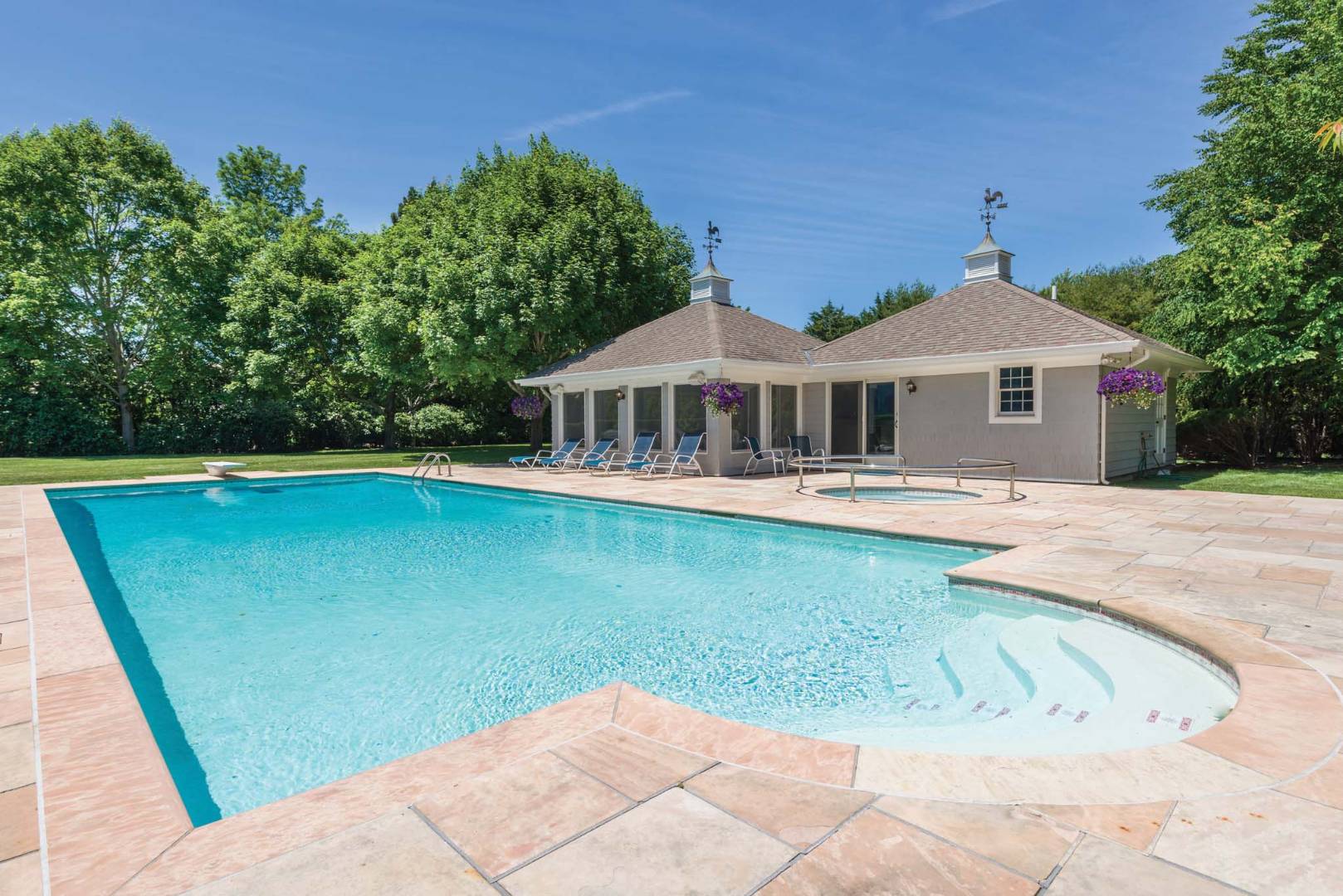 495 Ox Pasture Road Southampton, NY 11968 - Photo 27 of 28 a view of a house with a swimming pool