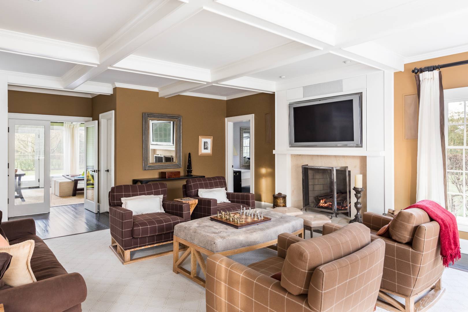 495 Ox Pasture Road Southampton, NY 11968 - Photo 8 of 28 a living room with fireplace furniture and a flat screen tv