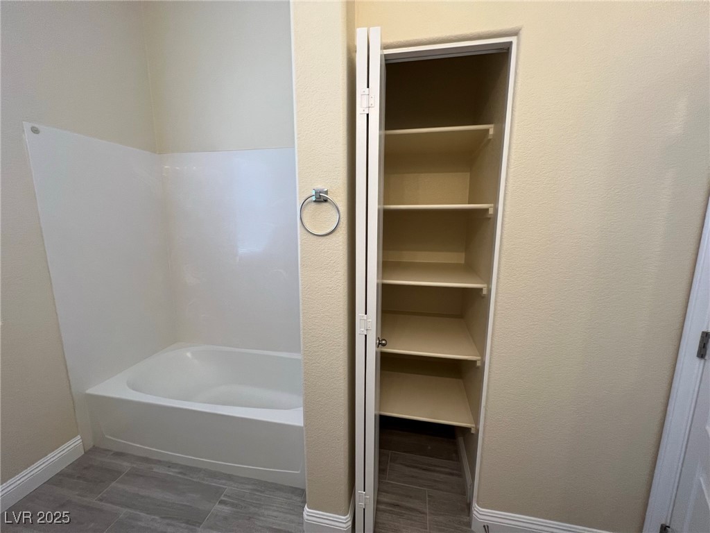 8805 Jeffreys Street, Unit 1111 Las Vegas, NV 89123 - Photo 26 of 35 Bathroom with bathing tub / shower combination and a closet