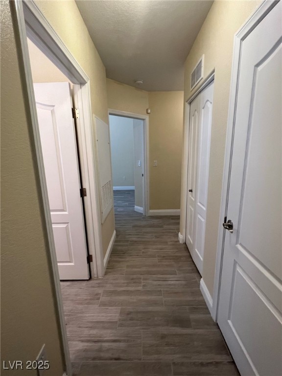 8805 Jeffreys Street, Unit 1111 Las Vegas, NV 89123 - Photo 30 of 35 Hall with baseboards and wood finish floors