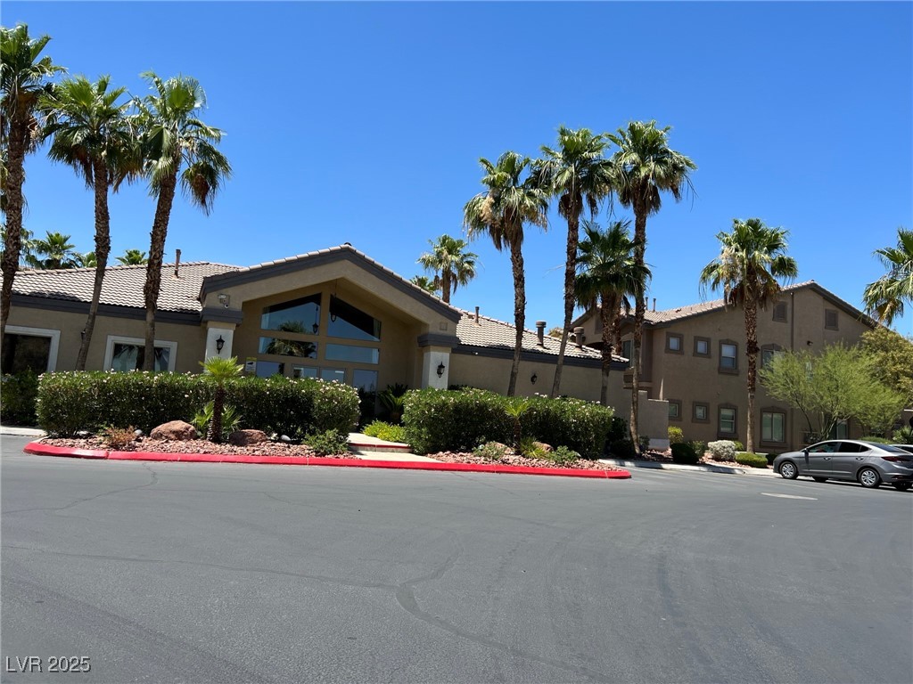 8805 Jeffreys Street, Unit 1111 Las Vegas, NV 89123 - Photo 33 of 35 View of front of home featuring stucco siding and a tiled roof