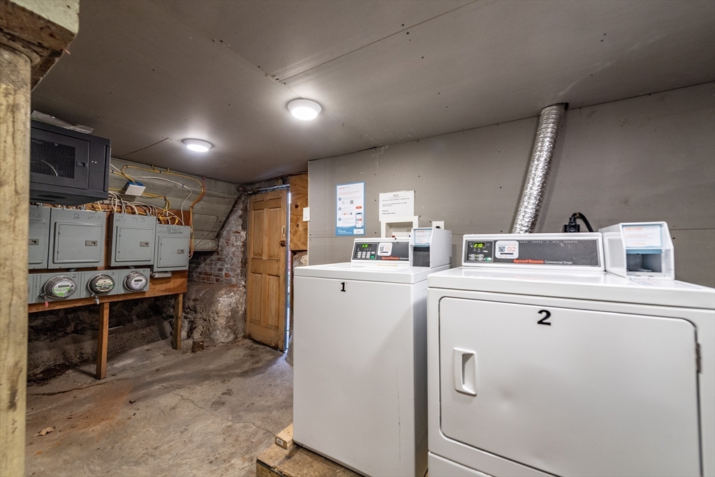 4 A Weld Avenue Boston, MA 02119 - Photo 6 of 6 a view of a storage & utility room with washer and dryer