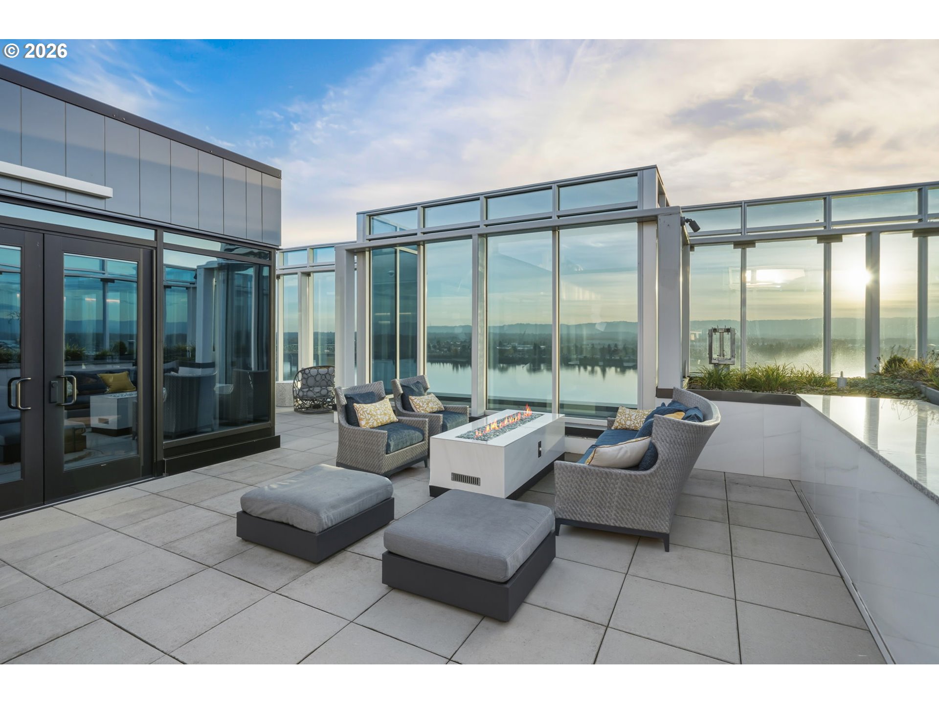 590 Waterfront Way, Unit 703 Vancouver, WA 98660 - Photo 3 of 4 a living room with furniture and a large window