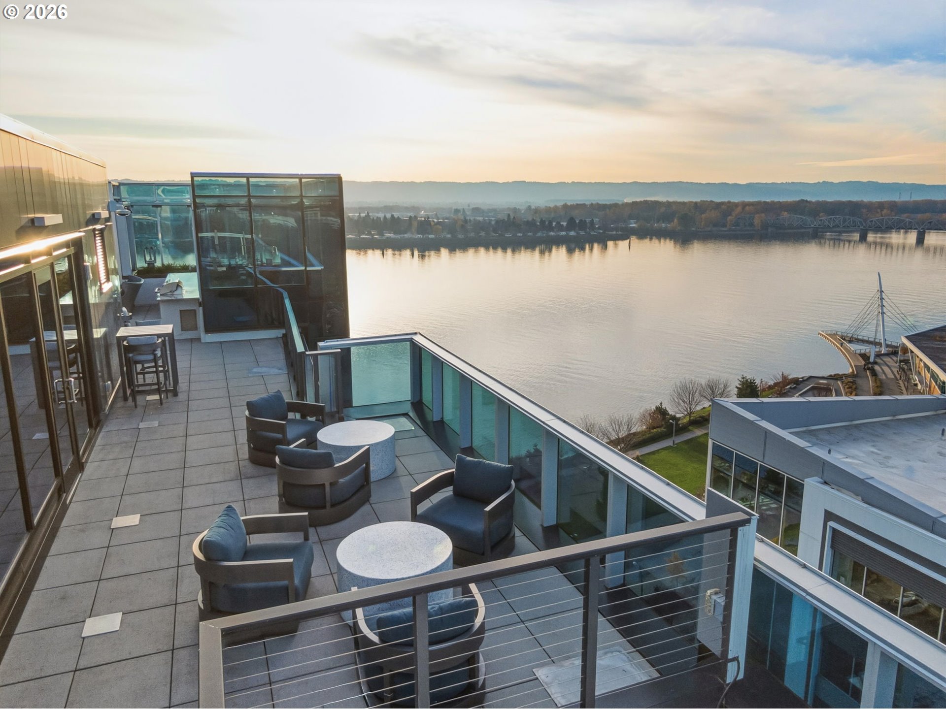 590 Waterfront Way, Unit 703 Vancouver, WA 98660 - Photo 4 of 4 a terrace with outdoor seating and city view