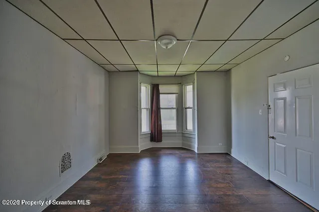 a view of livingroom with window and wooden floor