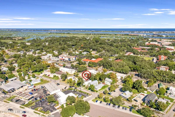 an aerial view of residential building and ocean