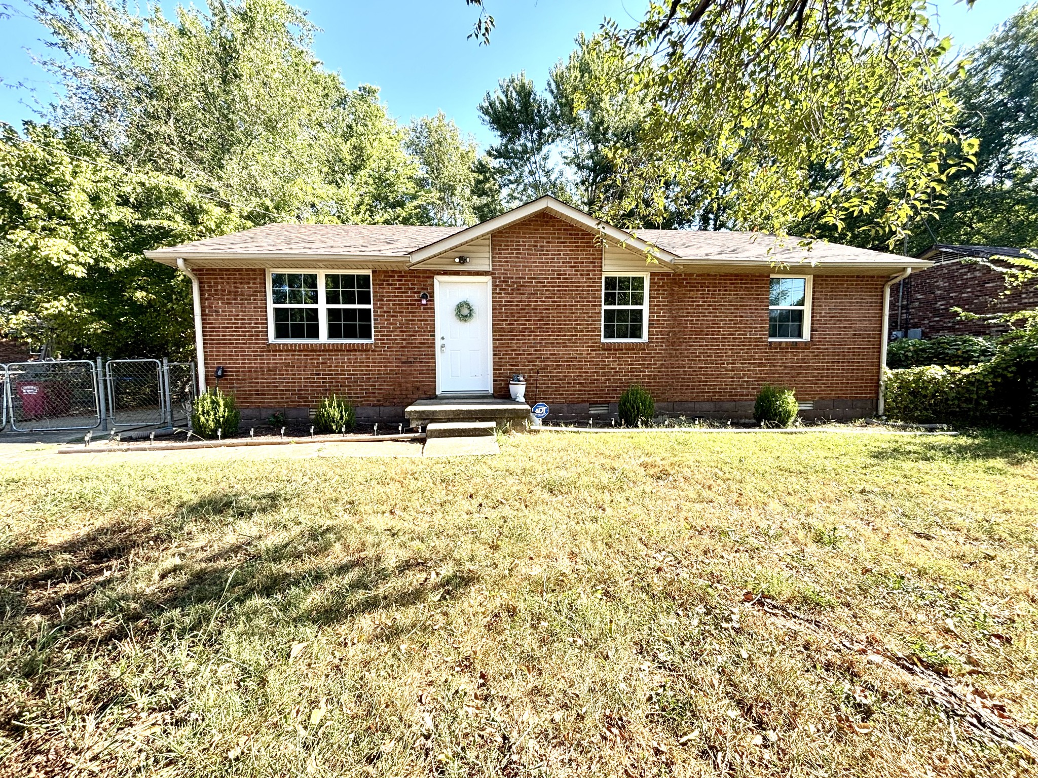 a front view of a house with a yard
