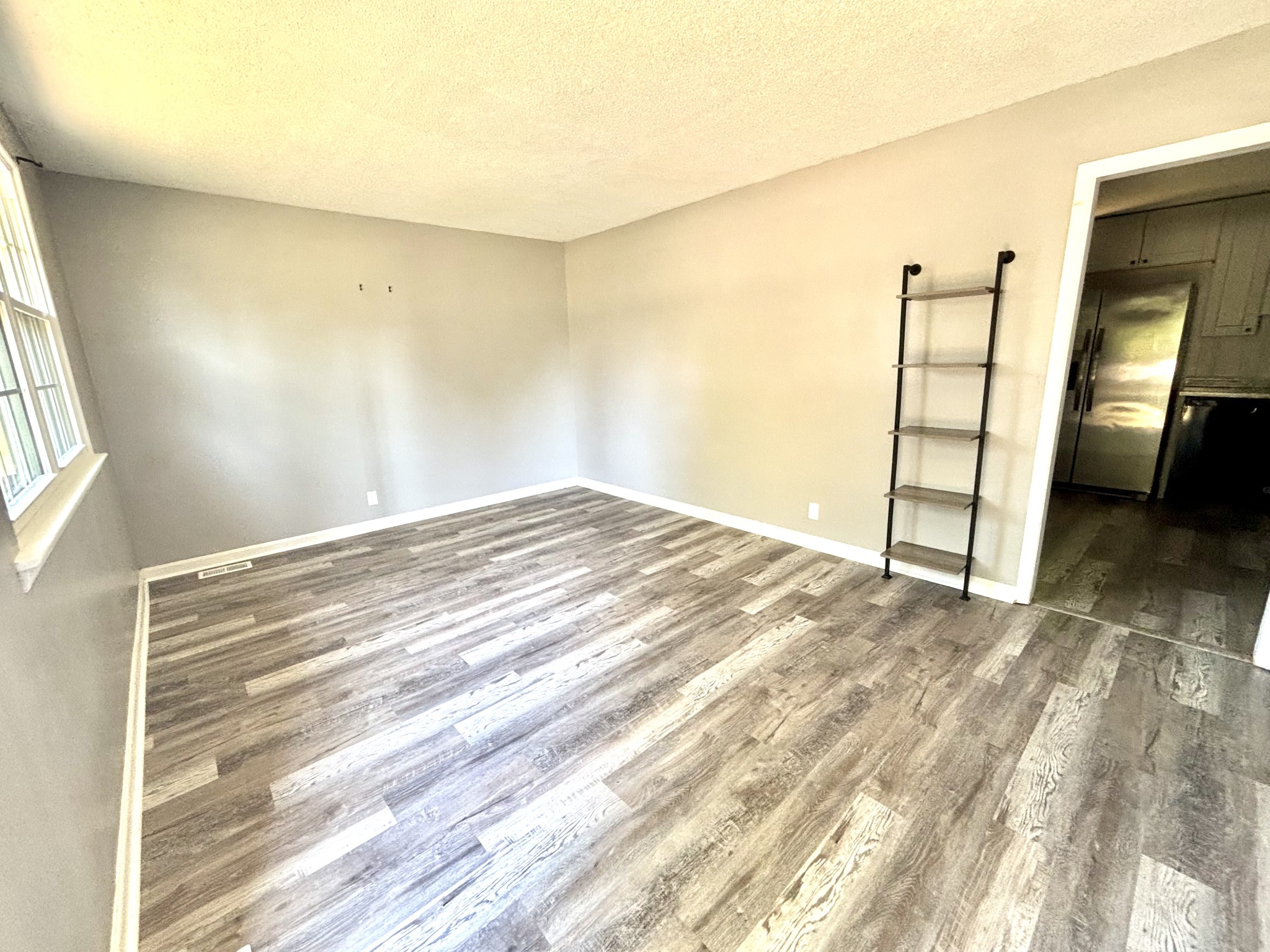 623 Lafayette Road Clarksville, TN 37042 - Photo 2 of 12 a view of empty room with wooden floor and cabinet