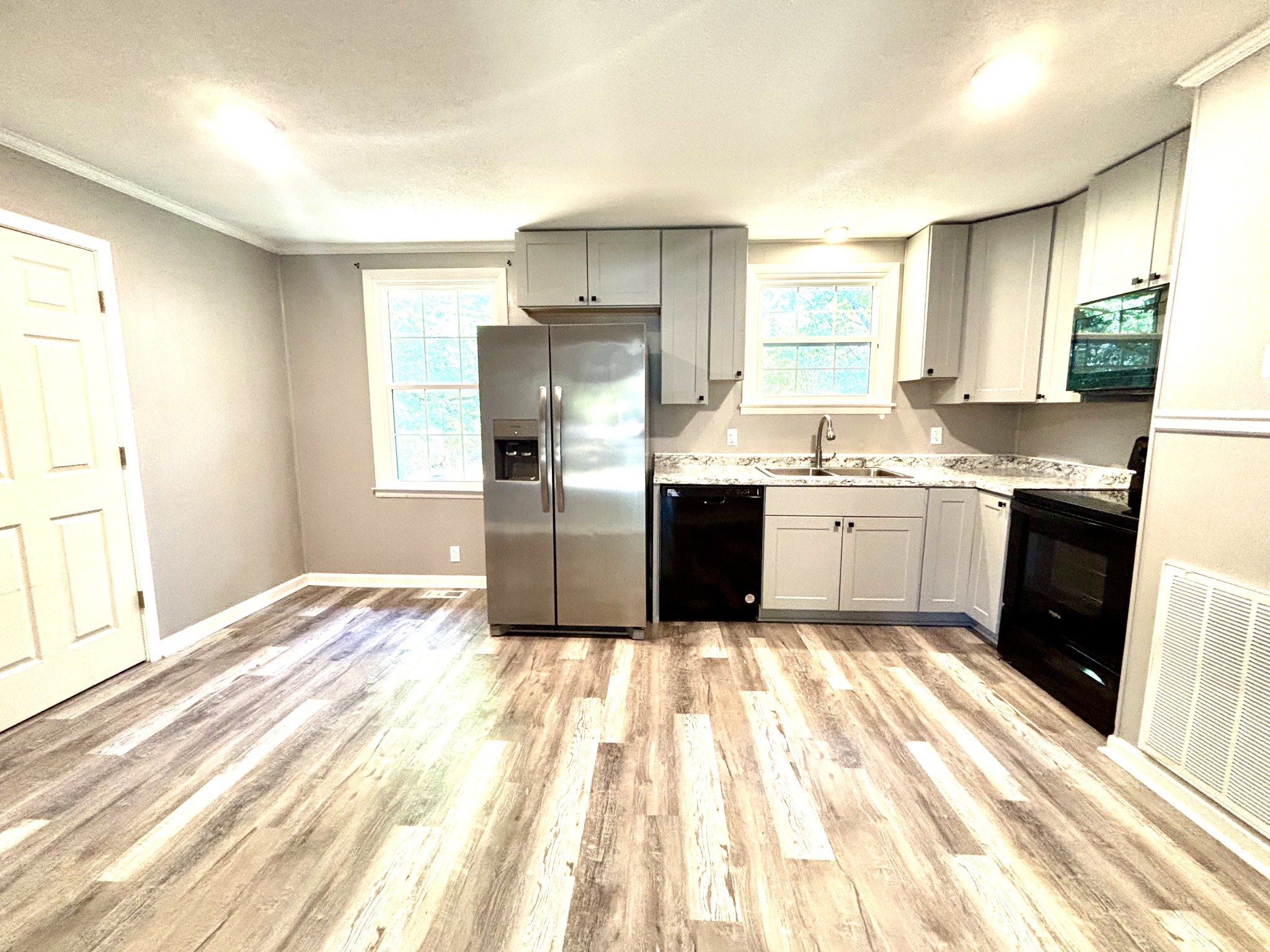 623 Lafayette Road Clarksville, TN 37042 - Photo 3 of 12 a kitchen with granite countertop a sink stainless steel appliances and cabinets