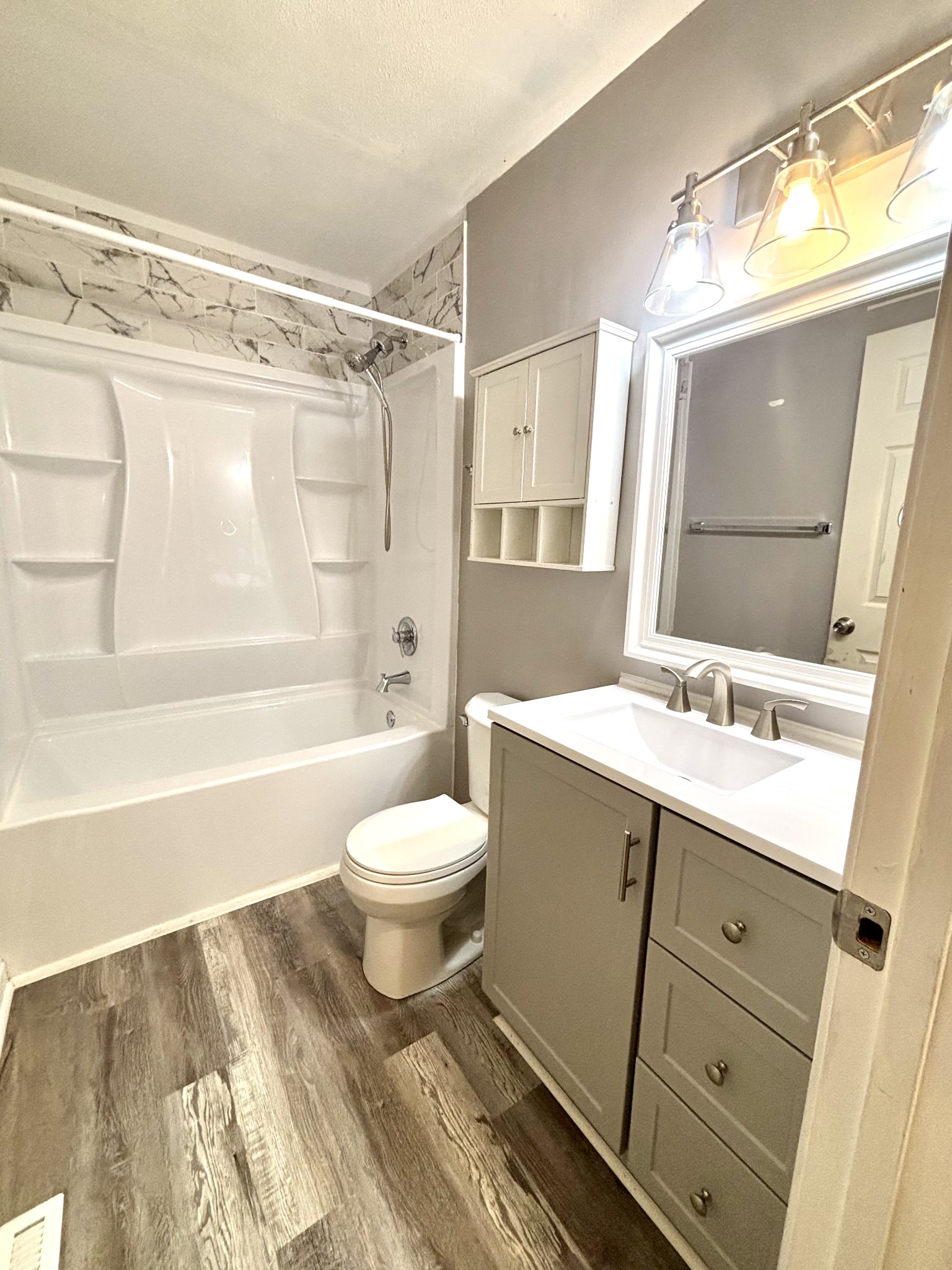 623 Lafayette Road Clarksville, TN 37042 - Photo 7 of 12 a bathroom with a sink a toilet and a mirror