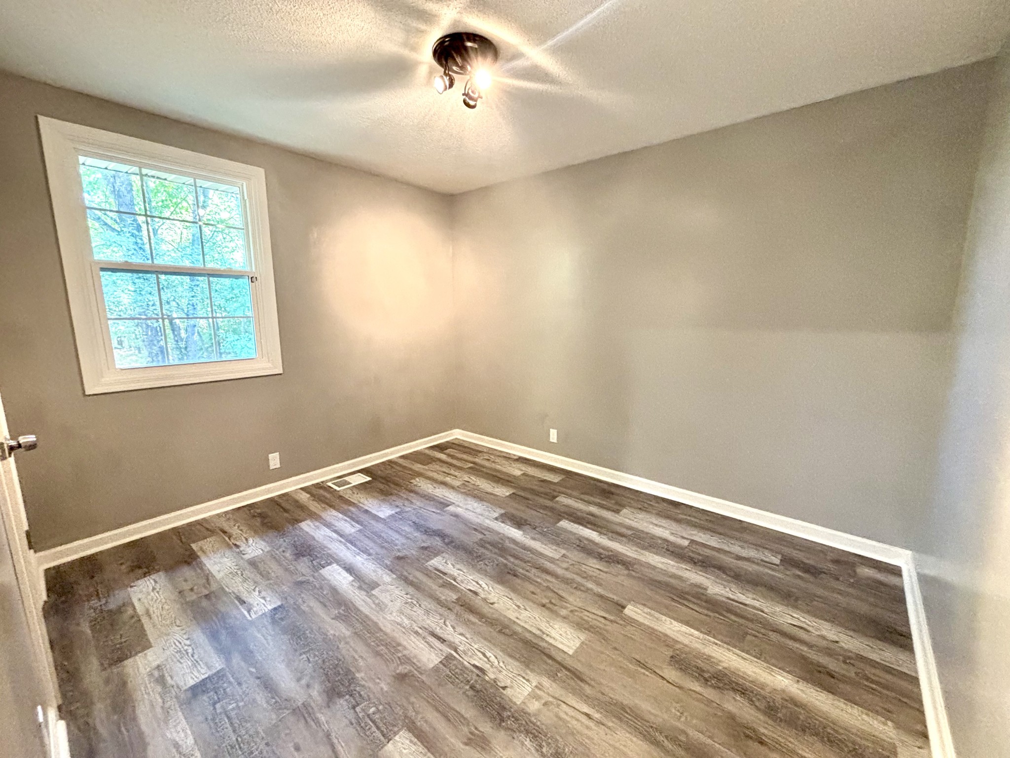 623 Lafayette Road Clarksville, TN 37042 - Photo 8 of 12 a view of empty room with wooden floor