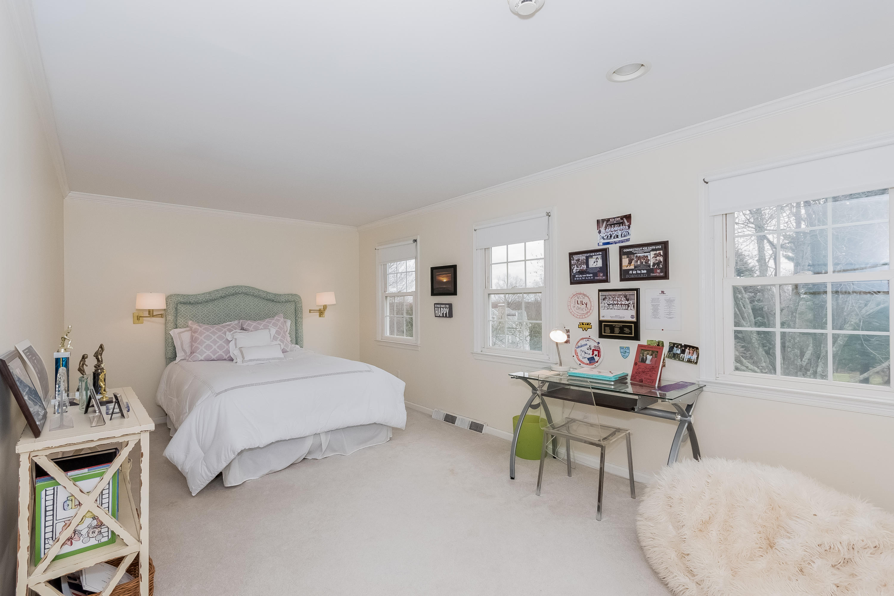 71 Peach Hill Road Darien, CT 06820 - Photo 25 of 42 a bedroom with a bed a table and chair