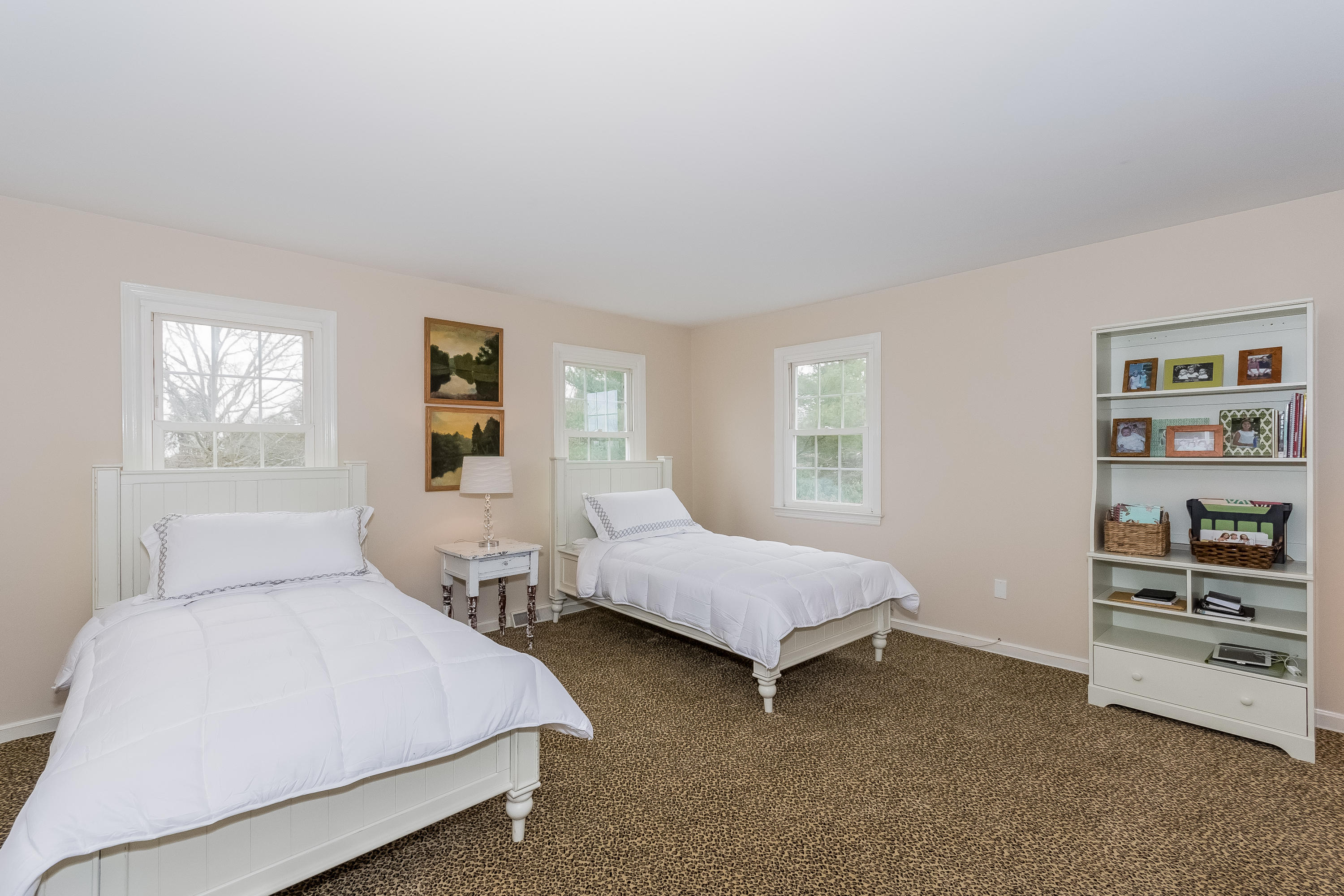 71 Peach Hill Road Darien, CT 06820 - Photo 27 of 42 a bedroom with two beds and a window