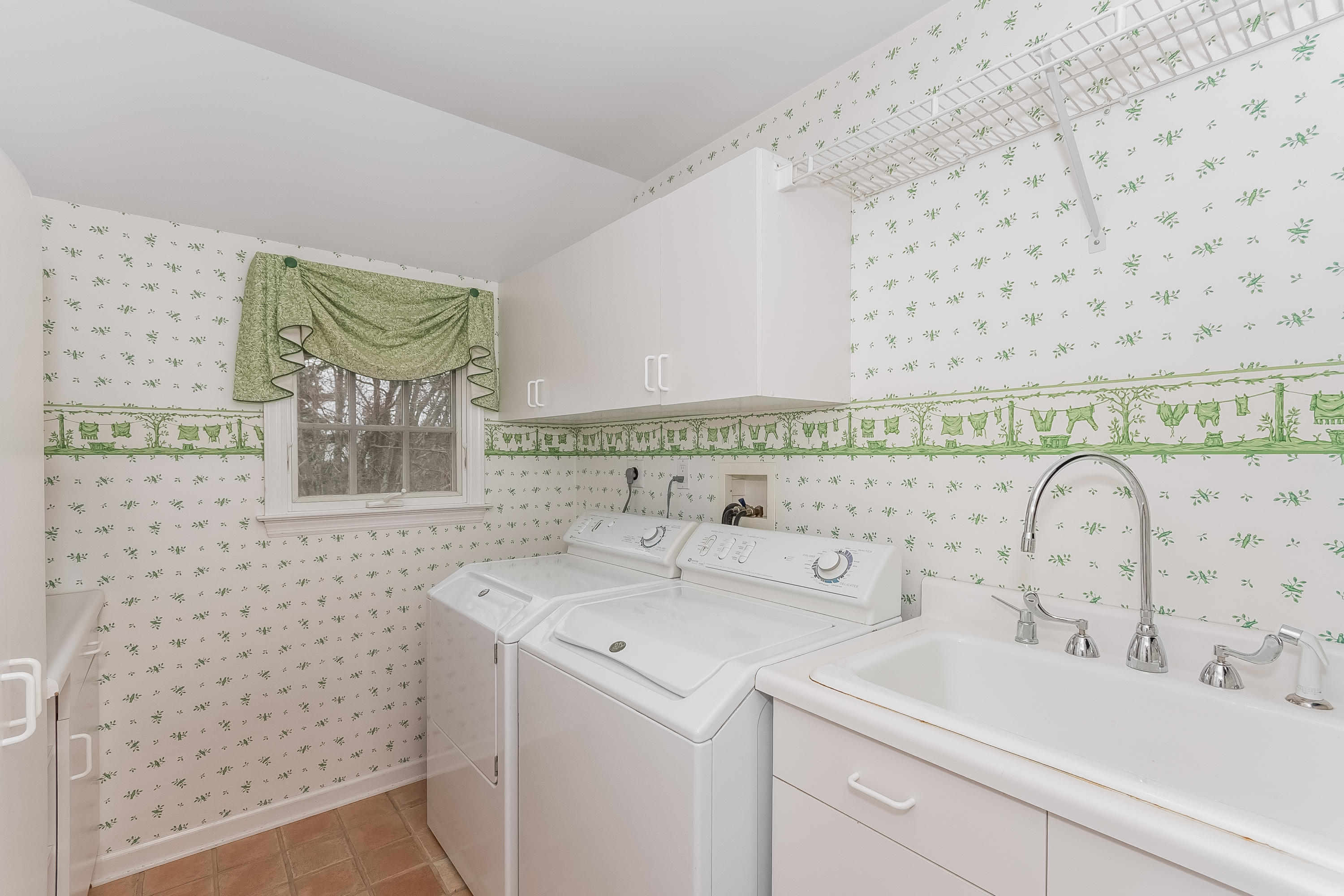 71 Peach Hill Road Darien, CT 06820 - Photo 28 of 42 a view of bathroom with a sink and a mirror