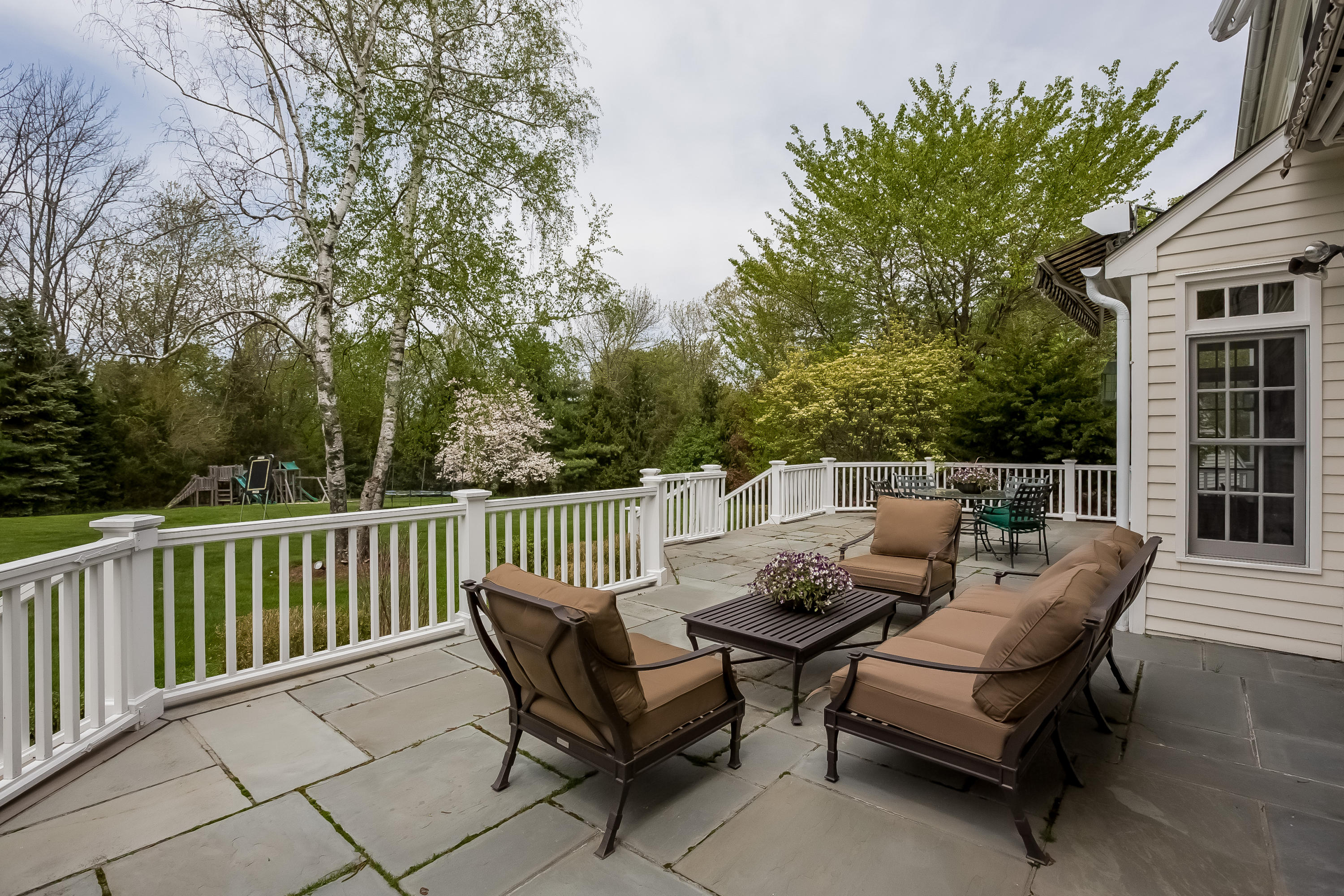 71 Peach Hill Road Darien, CT 06820 - Photo 36 of 42 a roof deck with couches and wooden fence