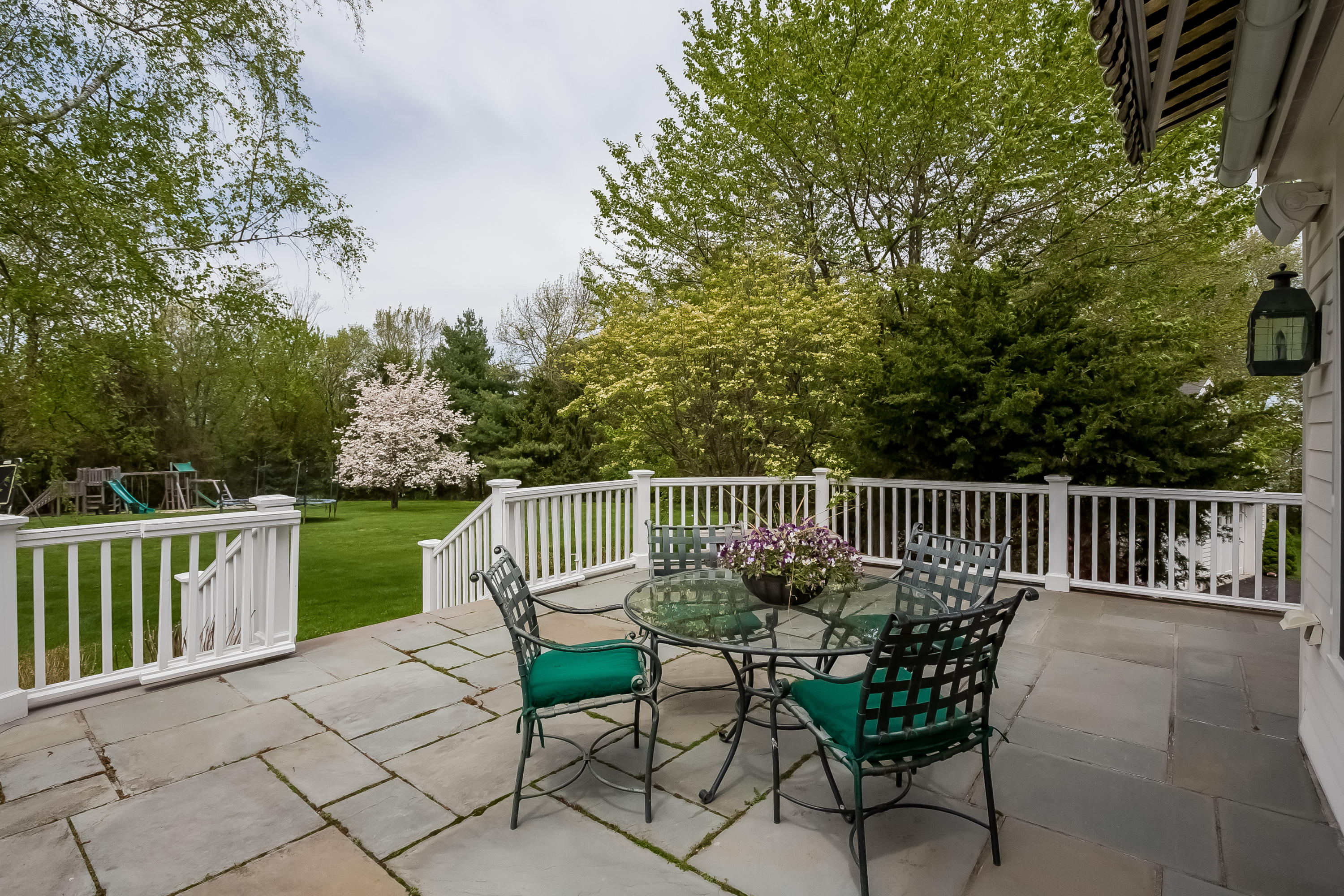 71 Peach Hill Road Darien, CT 06820 - Photo 37 of 42 a view of a chair and table on the terrace