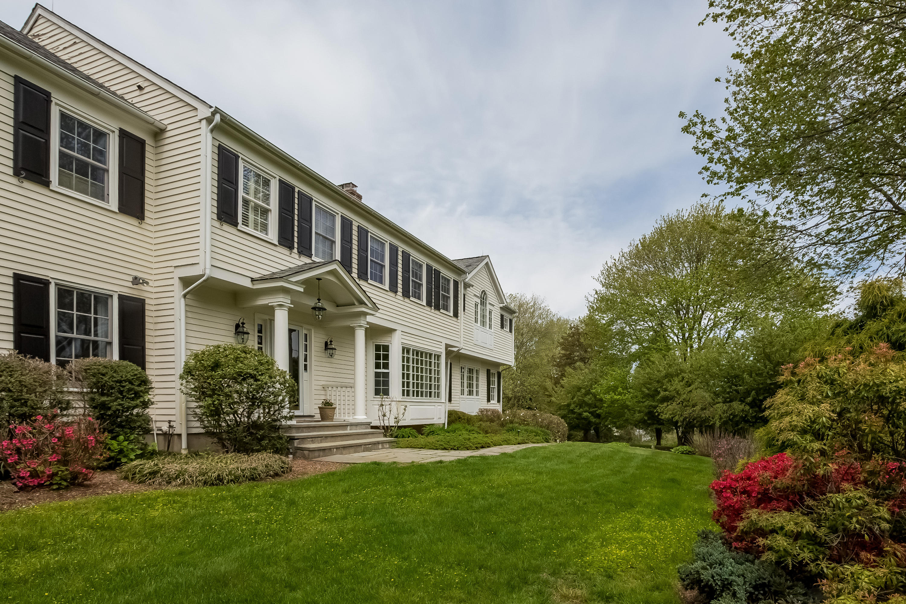 71 Peach Hill Road Darien, CT 06820 - Photo 42 of 42 a front view of a house with a yard