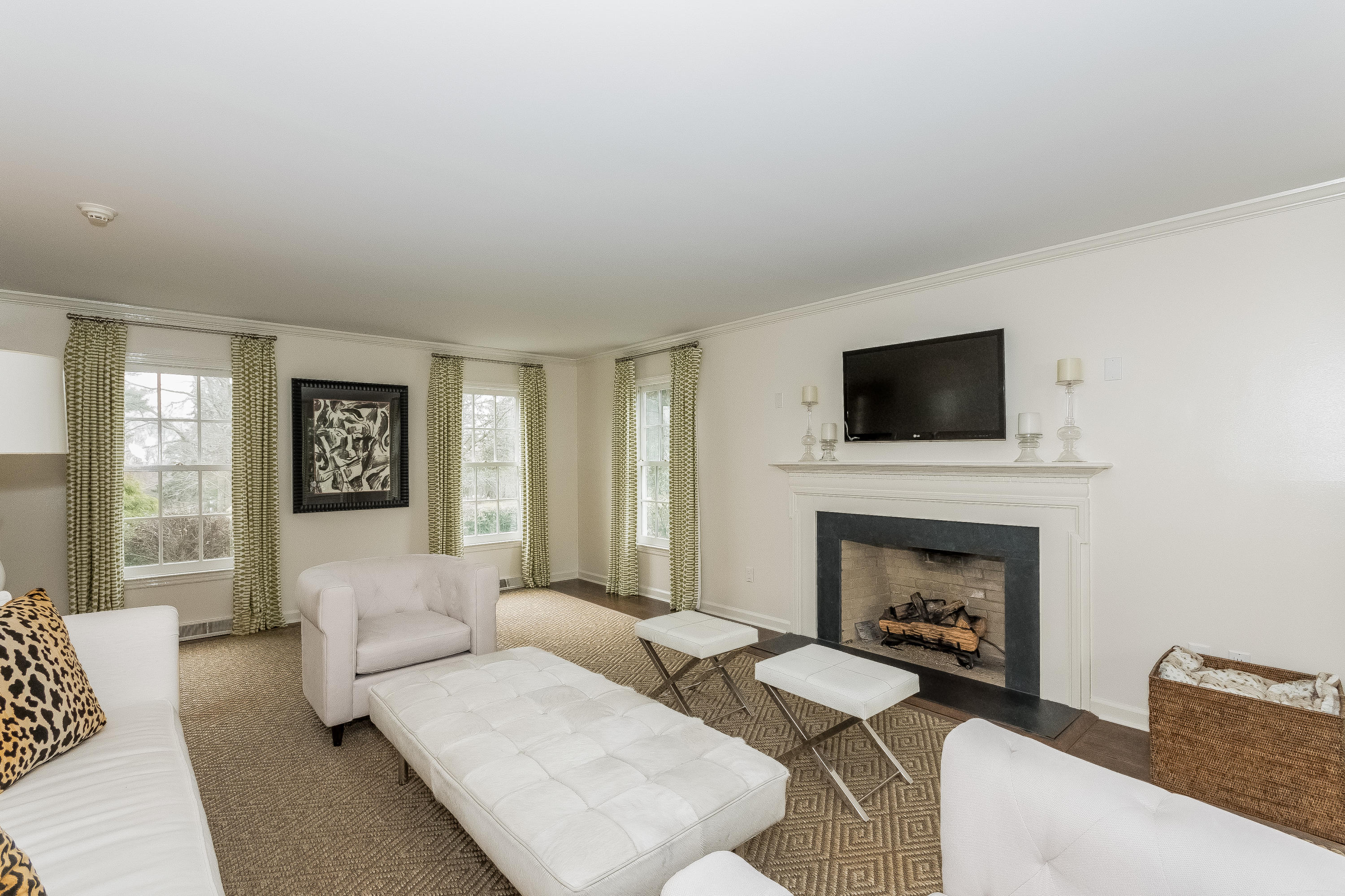 71 Peach Hill Road Darien, CT 06820 - Photo 5 of 42 a living room with furniture a flat screen tv and a fireplace