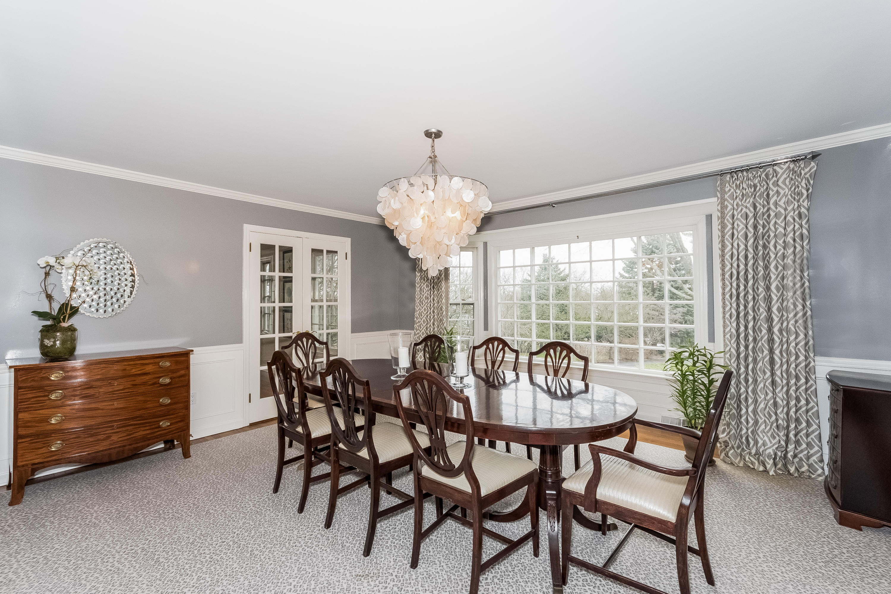 71 Peach Hill Road Darien, CT 06820 - Photo 7 of 42 a view of a dining room with furniture and windows