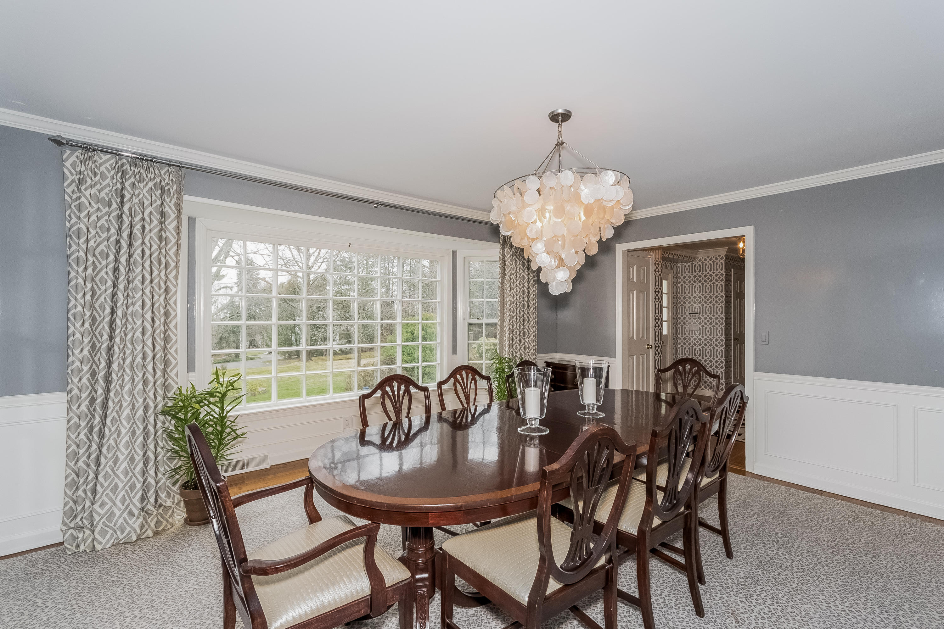 71 Peach Hill Road Darien, CT 06820 - Photo 8 of 42 a view of a dining room with furniture window and outside view