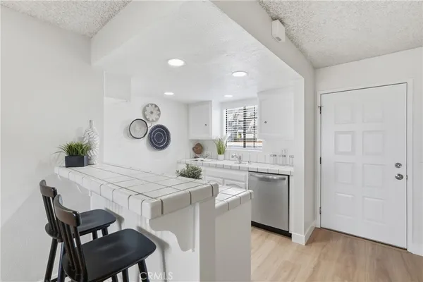 a kitchen with a stove and a sink