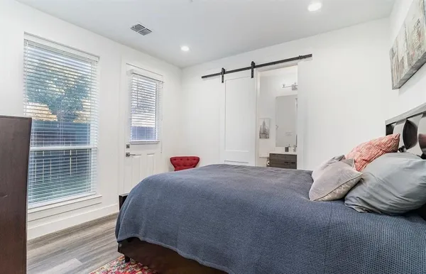 a bedroom with a bed and a table in it