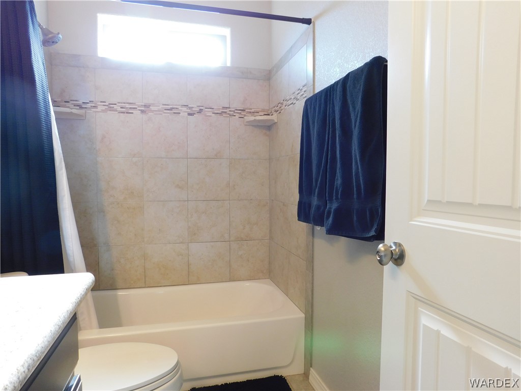 3370 South Ridge Avenue Bullhead City, AZ 86429 - Photo 43 of 56 a bathroom with a toilet and a bathtub