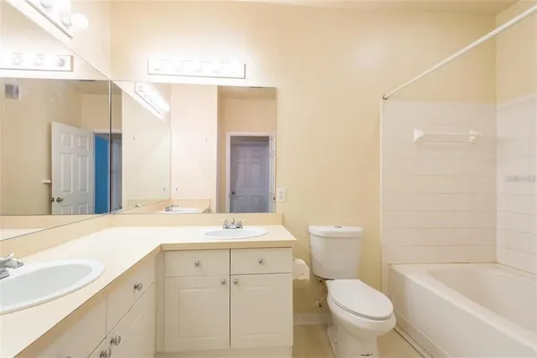a bathroom with a sink a toilet and a bathtub