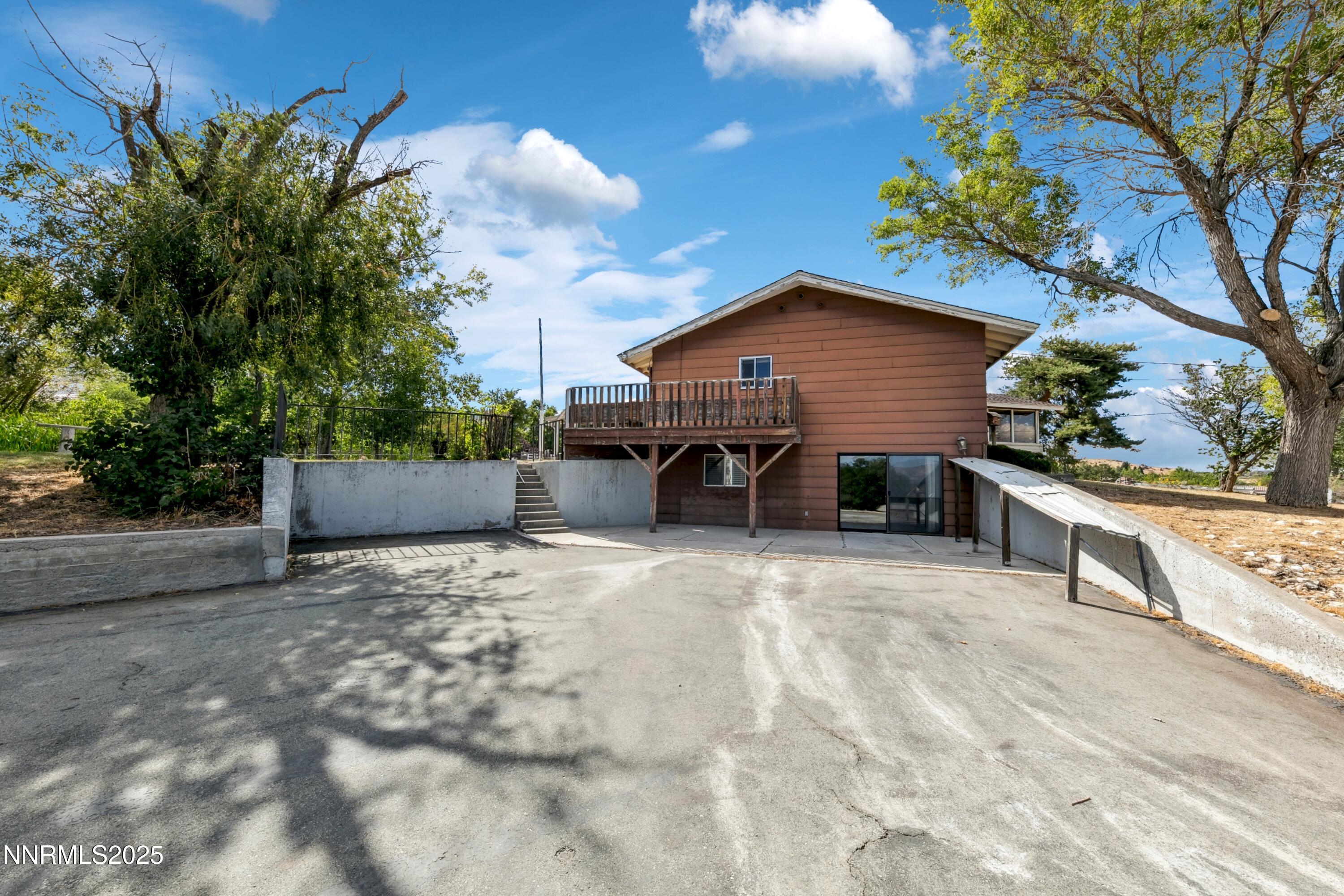 3550 Lone Tree Lane Reno, NV 89511 - Photo 18 of 40 a view of a house with wooden fence