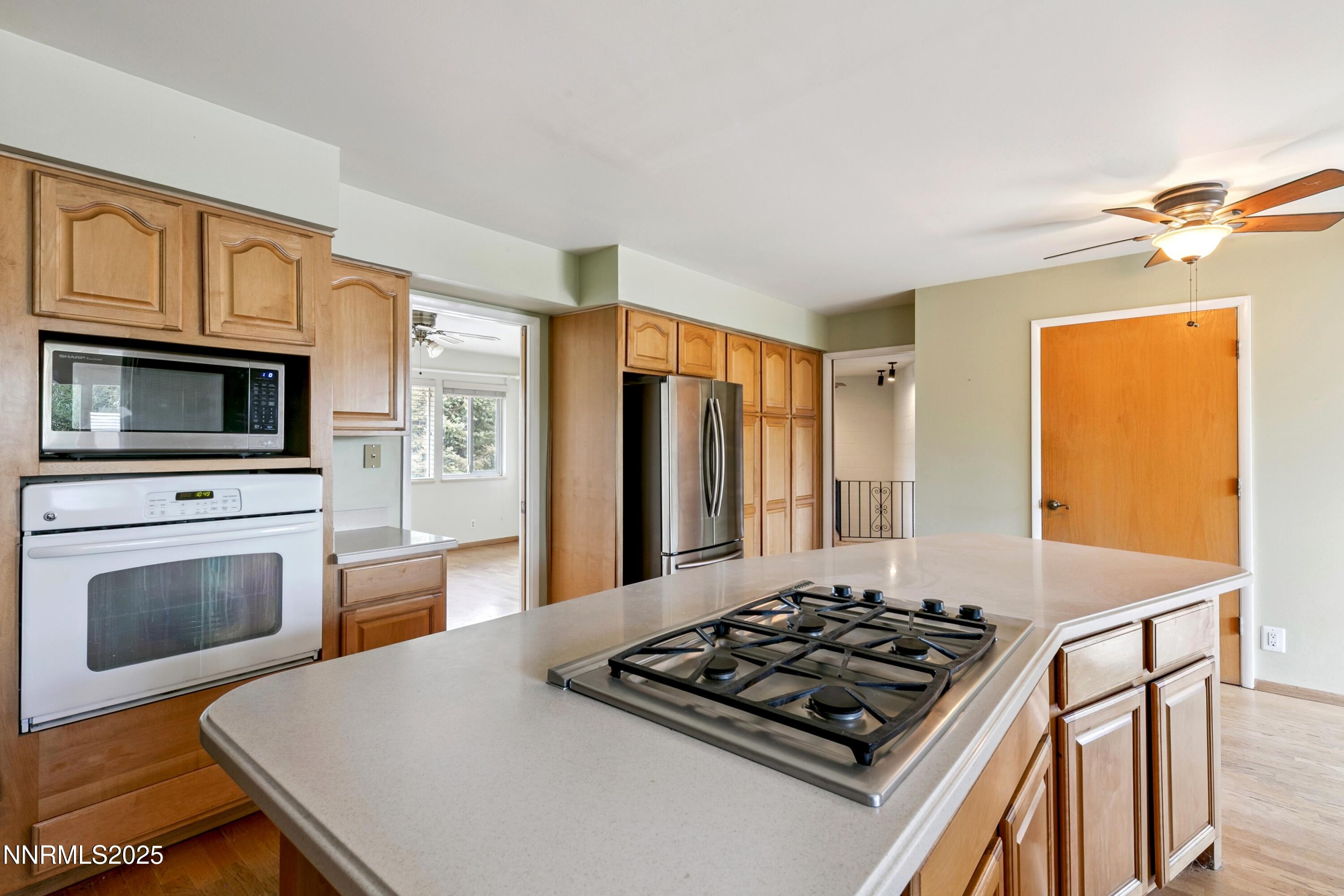 3550 Lone Tree Lane Reno, NV 89511 - Photo 28 of 40 a kitchen with a stove and a microwave