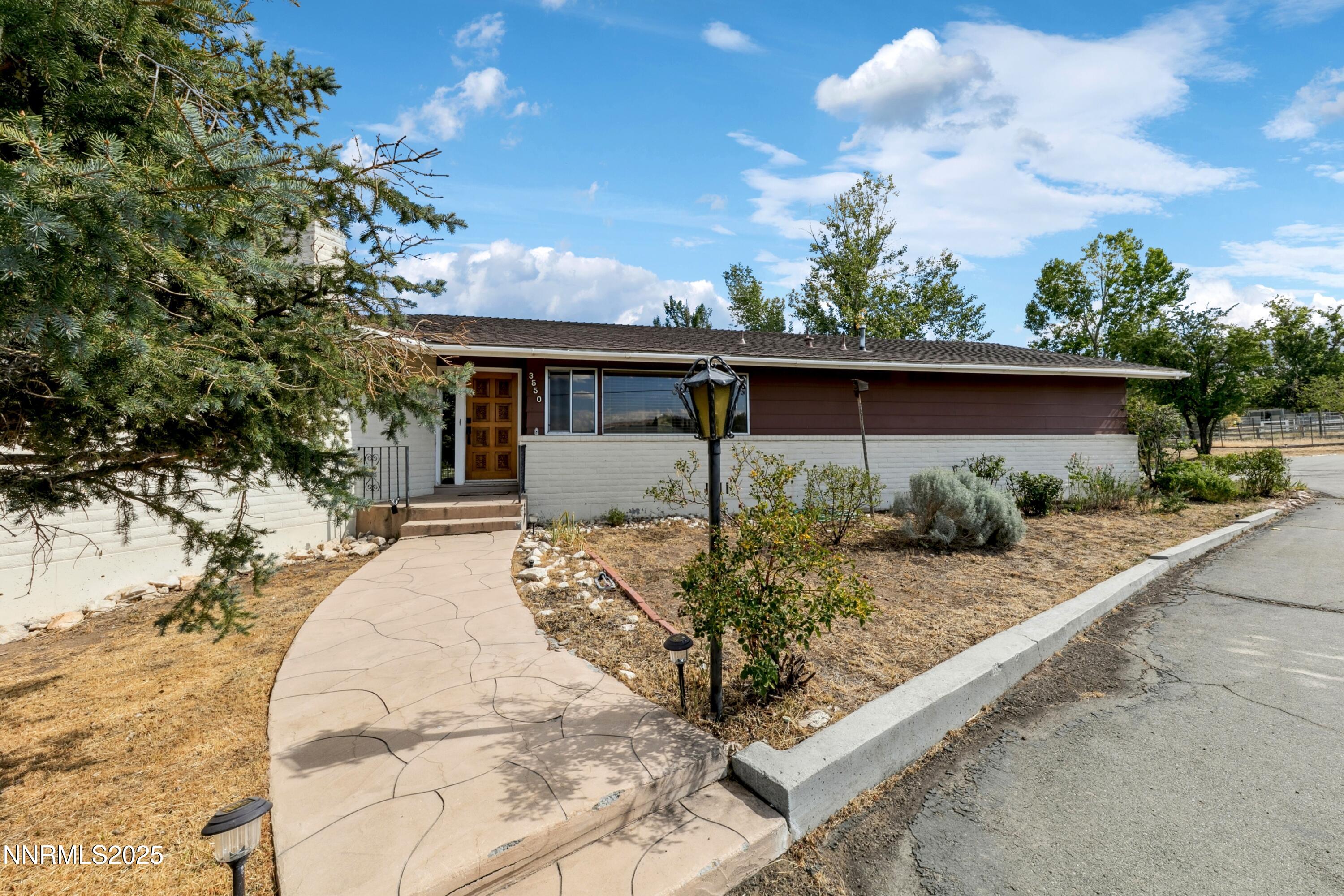 3550 Lone Tree Lane Reno, NV 89511 - Photo 4 of 40 a view of a house with backyard