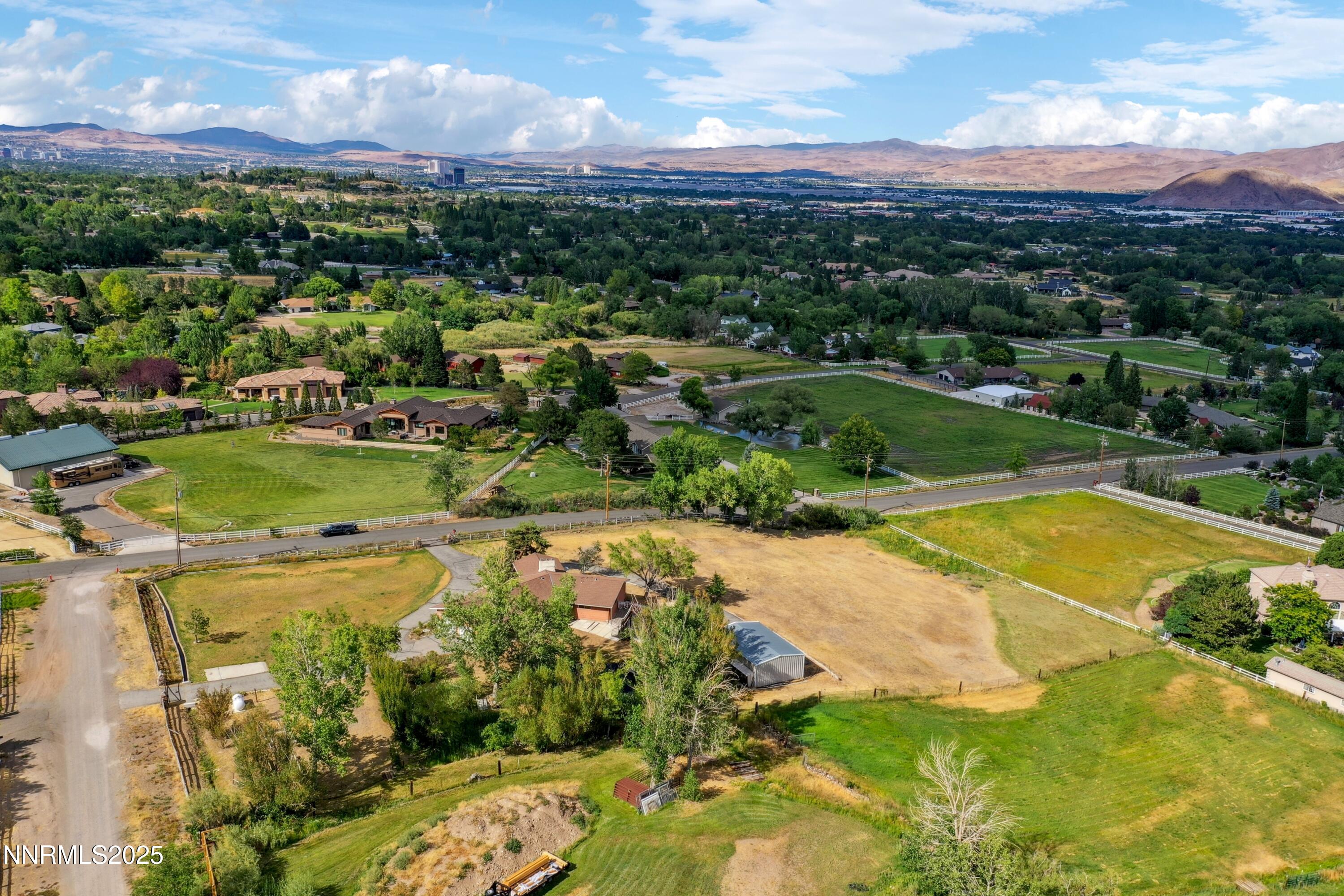 3550 Lone Tree Lane Reno, NV 89511 - Photo 6 of 40 a view of a swimming pool with a yard